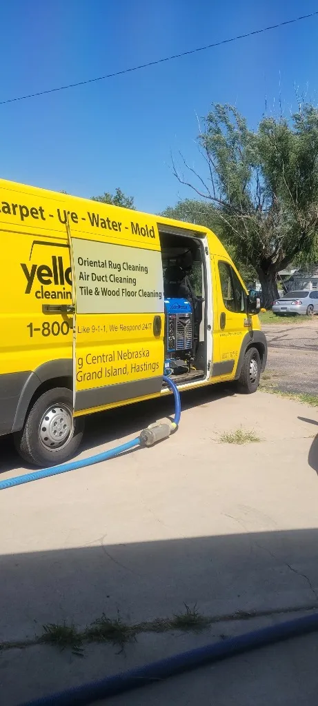 Yellow Van emergency water extraction crew deploying commercial drying equipment to remediate residential property water damage.