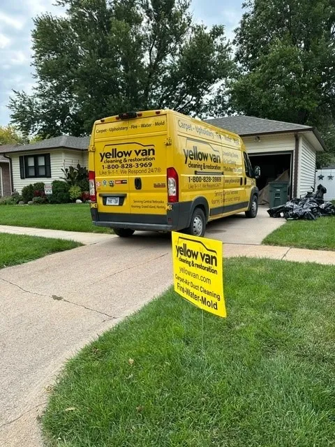 Yellow Van Cleaning & Restoration service vehicle on site